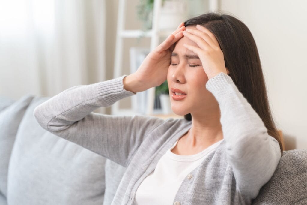 Woman experiencing dizziness